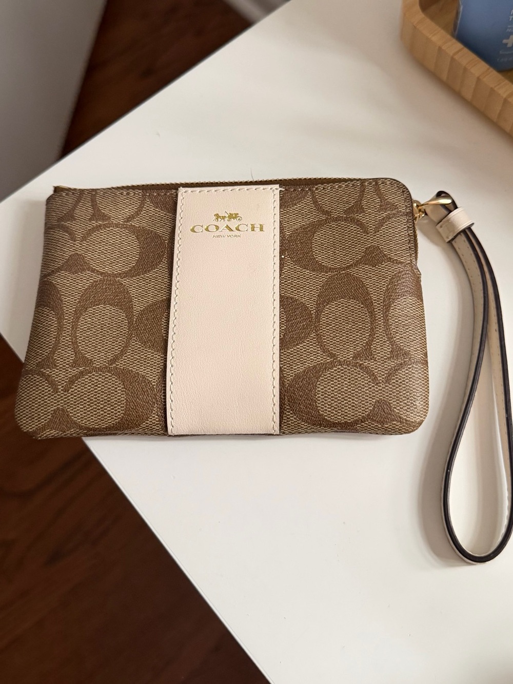 Coach Brown Signature Canvas Wristlet with Cream Center Stripe
